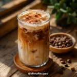 Ultra-realistic Brown Sugar Shaken Espresso Recipe served in a tall glass with ice, espresso, oat milk, cinnamon, and light foam on a rustic wooden table.